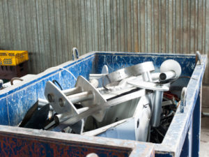 Dumpster with metal scrapping
