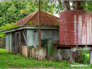 Old shed& water tank in Montgomery Texas - hire a junk removal service to get rid of it for you