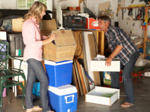 Couple laughing while garage decluttering in Spring Texas