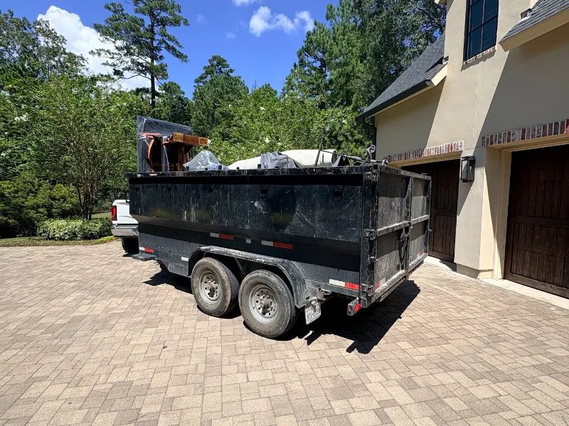 All-In Hauling dumpster trailer loaded for a Grangerland, TX project