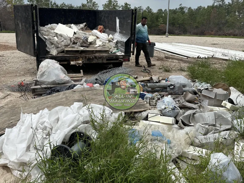 Junk removal Grangerland TX: debris loaded into an All-In Hauling trailer